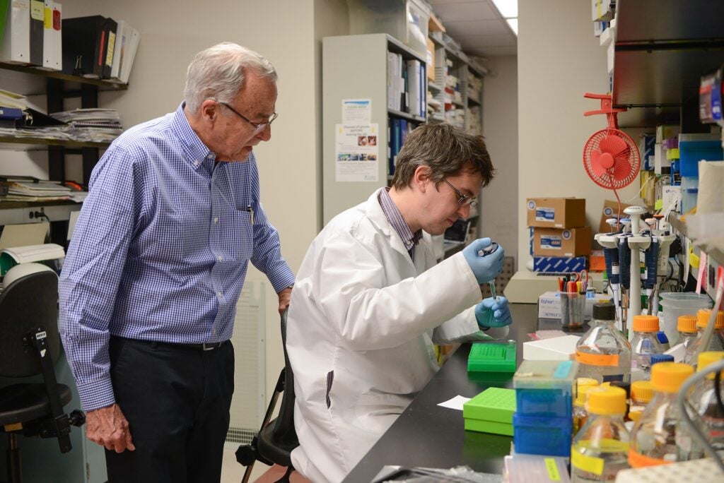Two people standing in a lab.
